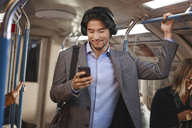 Image of male on subway wearing Jabra Evolve2 75 Bluetooth headset