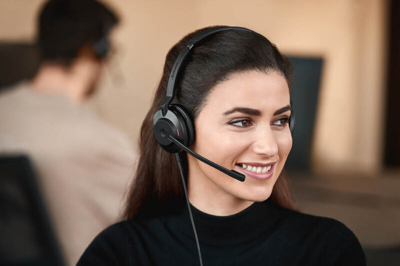 Image of smiling woman with noise cancelling headset