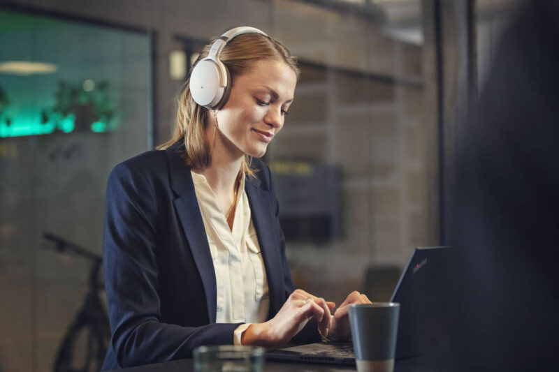 woman with noise cancelling headset working peacefully