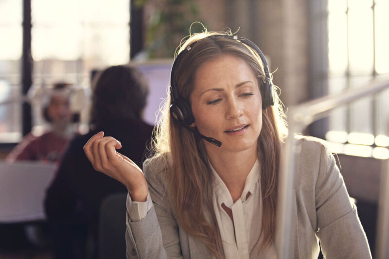 Image of Woman wearing noise cancelling headset