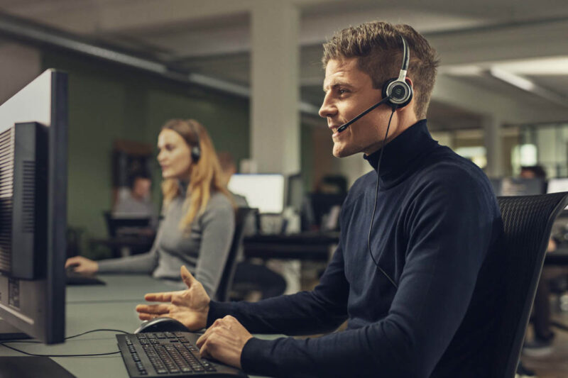 Man in call wearing MS headset