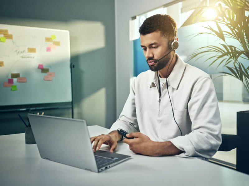 Image of Man in labcoat wearing active noise cancelling headset