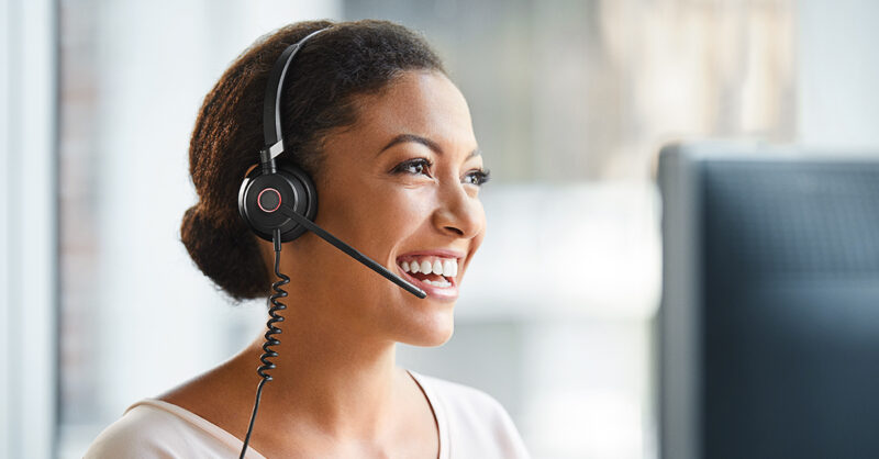 Image of smiling woman wearing a usb headset