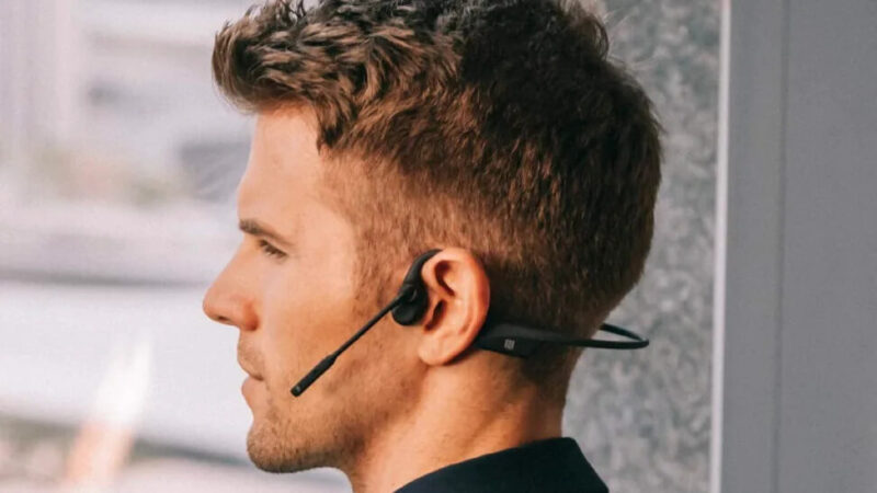 Image of man wearing Aftershokz Opencomm headset