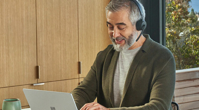 Man wearing microsoft wireless headset on call